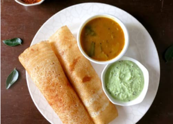 A plate of South India dosa with sambeer and chutney