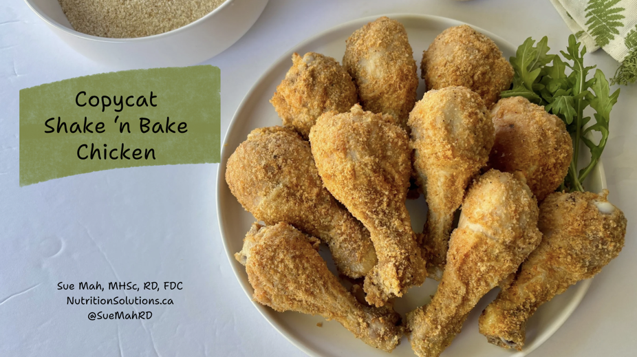 A plate of baked breaded chicken drumsticks