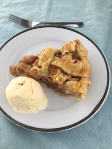 apple pie with ice cream on a plate