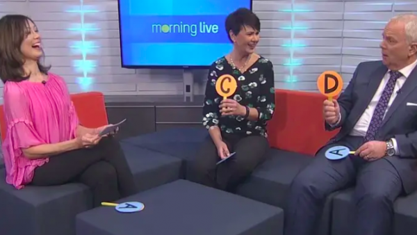 Sue Mah sitting on Sofa with TV Hosts Annette and Bob