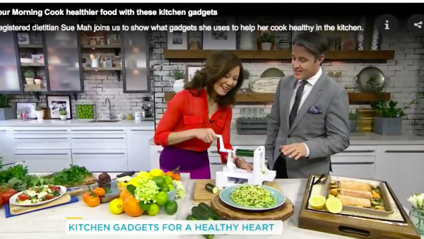 Registered Dietitian shows TV host Ben Mulroney how to work a spiralizer kitchen gadget.