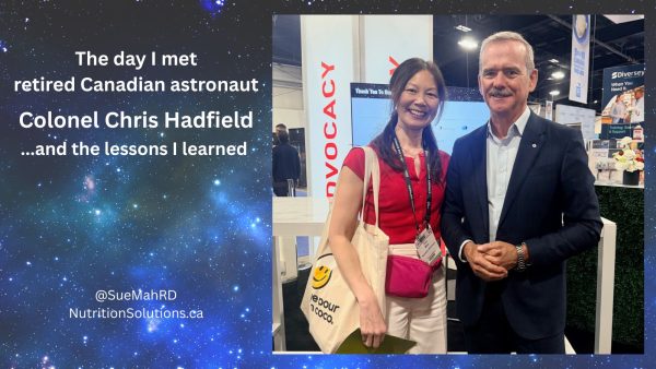 Sue is standing beside Colonel Chris Hadfield